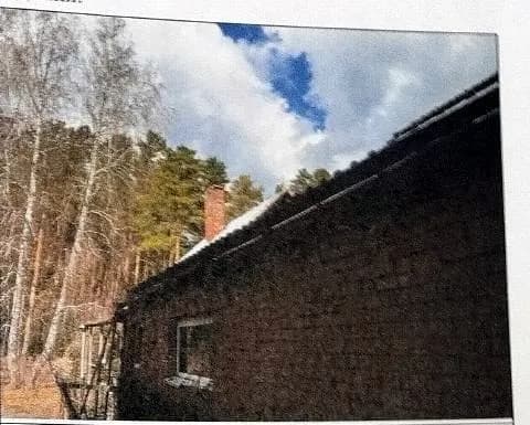 Фото из экспертизы: подшив кровли гаража 2001 года постройки